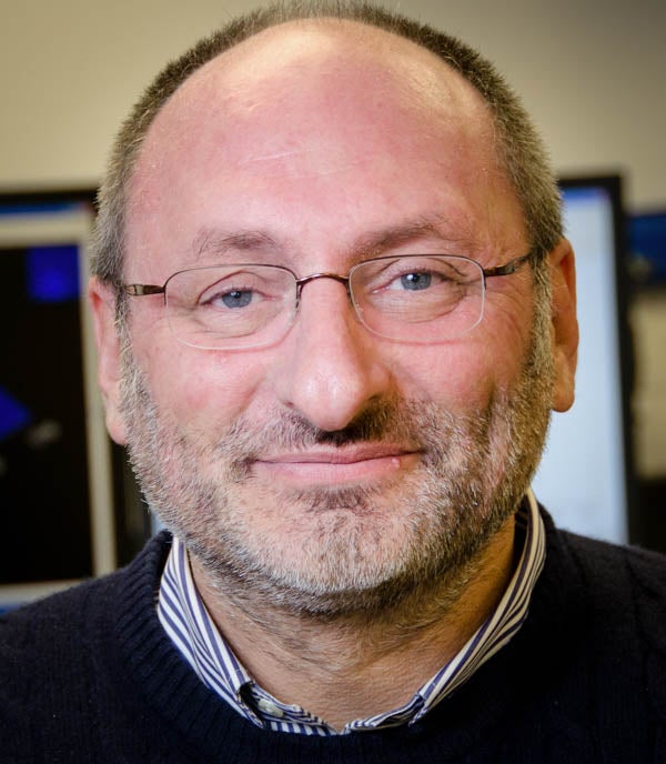 Portrait headshot of Professor Fabien Kenig. Man with very short brown, gray hair and glasses.