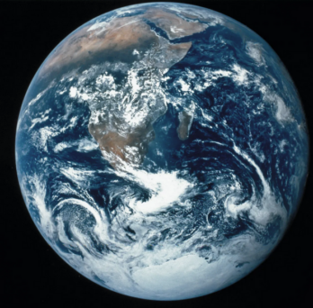 View of Earth from space including depictions of land, ocean, and clouds. 